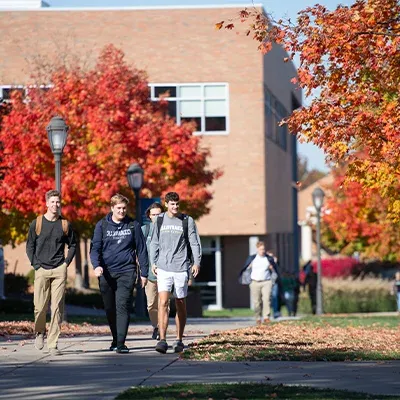 Students walking outside on campus.