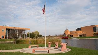 The United States flag waves by Cedar Lake